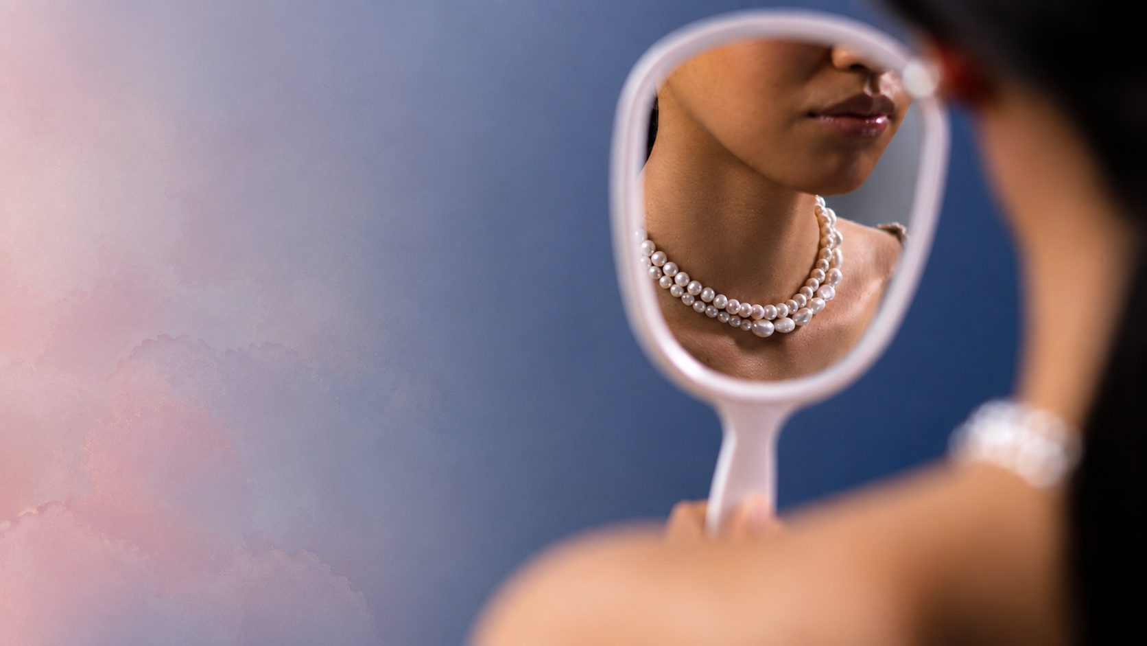 A woman looking into a mirror, from the ebook’s pride video section